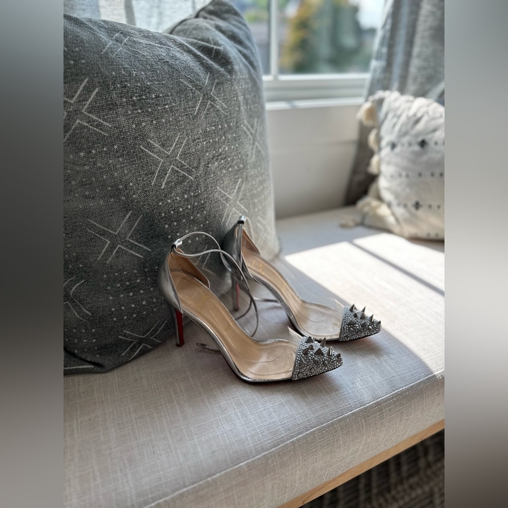 Christian Louboutin Stiletto Heels with embellished toe detail.